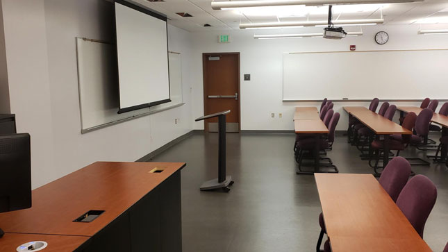 Room on the second floor at the University Center with chairs/table layout.