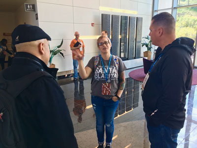 Lead Organizer speaking with two attendees at WordCamp Santa Clarita.